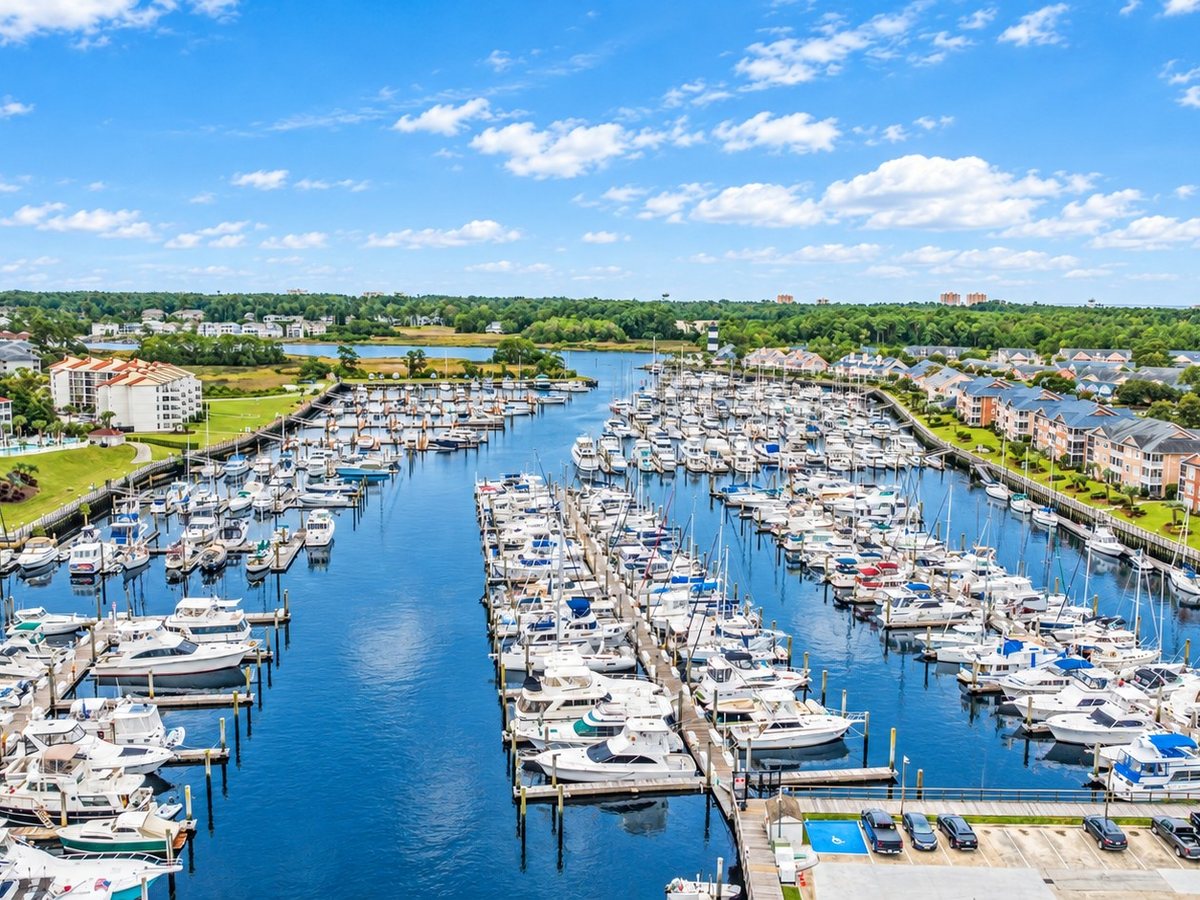 Boats docked at a Little River marina